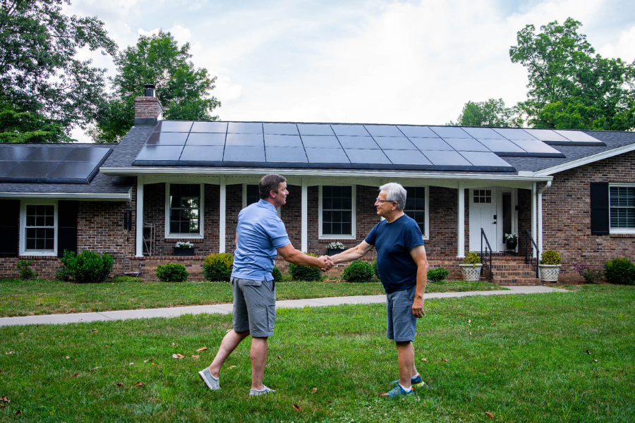 handshake over new solar installation